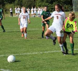 Sophie Marsh and Hornet GK Aisling Batchelder eye a loose ball