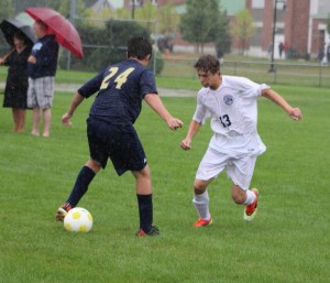 Gabe Perry gets by freshman Trevor Salema