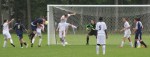 Josh Schneier gets a head on the ball as FA goalkeeper Blaine Andreoli watches