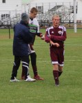 FA coach Bob Hodgman-Burns congratulates Brendan Qualls after the game