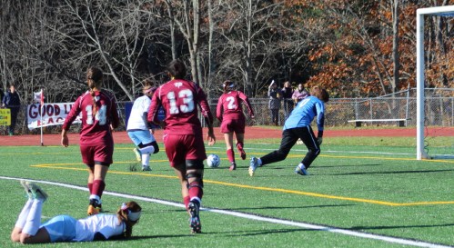 Emily Brookings (2) tries to clear the ball
