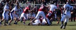 Bobby Drysdale (9) fumbles after hit by Alec Byrnes (66)