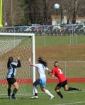 Windham GK Kate Kneeland, Ariana Davidson (11), and Katherine Kirk (21) in front of the Windham net