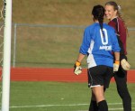 Liz Mycock chats with Sydney Martin before the penalty kicks begin