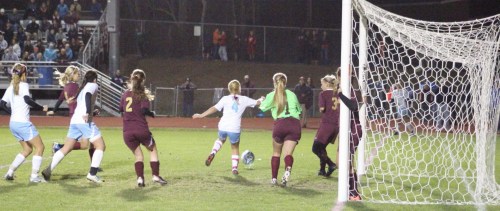 Emily Gorrivan (4) receives corner kick from Ciera Berthiaume