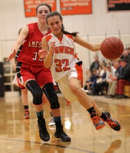 Freshman Kelsey Daly drives past Abigail Sartori