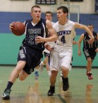 Griffin Beal (21) drives on Mark Hoyt (4)