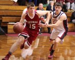 Patrick Davis (15) heads for the hoop with Ben Cherington (13) in pursuit
