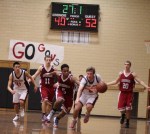 Kam Nobles (5) tries to steal from James McGrath (6)