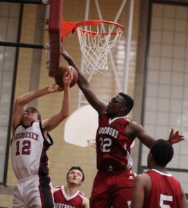 Matthew Peart (22) blocks Peter Beatty (12)