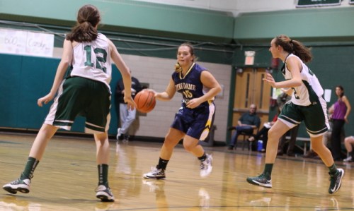 Kendra Delahunt (12 points) looks for an opening between Kelsi McNamara and Riley Holden