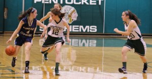 A trio of Pentucket defenders chase Janey Mathisen