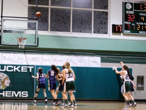 Hannah Hollow (#21) tries for a 4th three