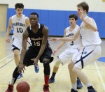 Brandon Hurst surrounded by a trio of Warriors