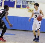 Eric Houska (20 points) looks for an opening