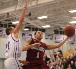Fred Hogan uses his left hand to get a layup against defender Devon Allen