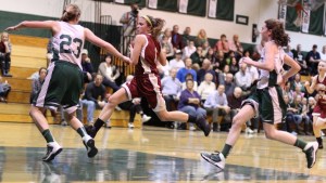 Aly Leahy (12 points) heads for the basket as McKenna Kilian defends