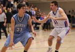 Daniel McCoy (33) drives on Matthew MacLeod (12)