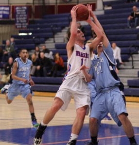 Sam Knollmeyer (10 points) battles with Brendan Barrett for a layup