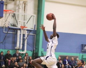 Jacquil Taylor (14 points) gets set to dunk