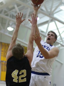 Julian Dunn (22 points) shoots over Bryce Fey
