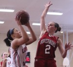 Jackie Ham goes for the block against Tate Jordan