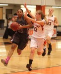 Michayla Woodward guards Deidra Newson (16 points)