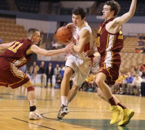 Austin Coene (18 points) goes between Ryan Roach and Joey Crane