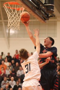 Nick Cambio (19 points) shoots over Mike Bisson