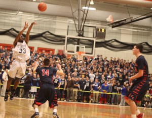 Kareem Davis launches a three at the end of the first quarter