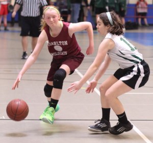 Bailey Savage (13 points) tries to get by Jordan Ulathorne