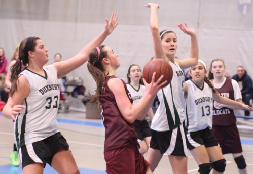 Julia Dandridge of Charlton gets in among the Duxbury shot blockers
