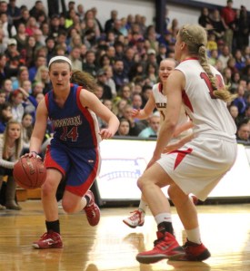 Jackie Luckhardt (10 points) drives on Haley Driscoll