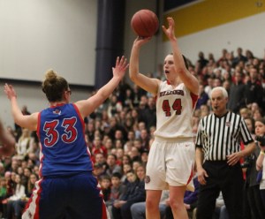 McKenzie Brown shoots a late three over Casey Evans