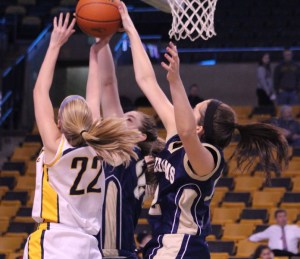 Jennie Mucciarone gets her shot blocked by two Archies