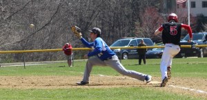 Nick Correnti stretches for his 10th putout