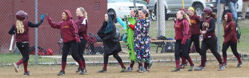 Carley Siemasko gets congratulated by teammates after homer in the third inning