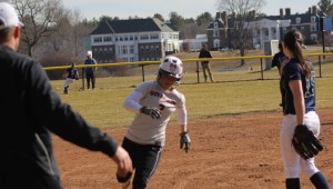 Coach Scott Kingsbury sends Sarah Dupere home as the ball reaches the fence