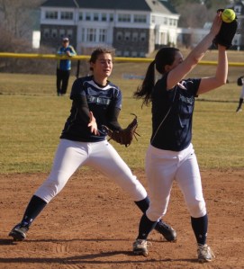 Gabby Munoz tries to catch a popup as Haley Sabino looks to help