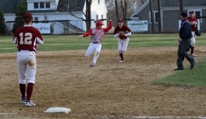 Elias Varinos caught in a rundown after driving in the 5th Masco run