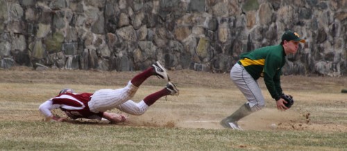Chase Carpenter dives into third as the ball drops in front of North Reading third baseman Tom Day
