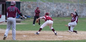 Hayden Roller slides for home as Leighton Paradise covers the plate