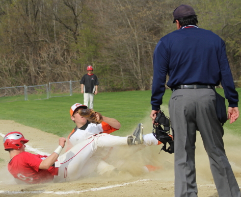 Pat Scanlon scores the second Amesbury run on a close play at the plate.