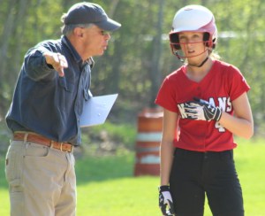 AHS coach Chris Perry instructs Meg Aponas