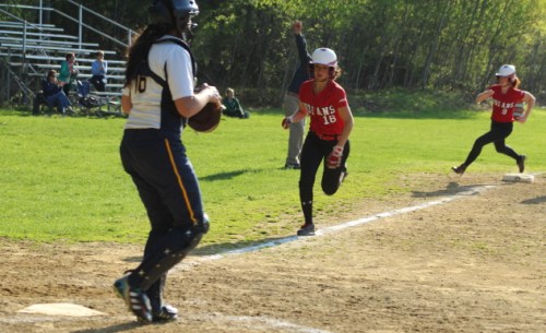Amanda Schell and Rachel Cyr race home on a 2-run single by Zoe Fitzgerald in the 8th inning