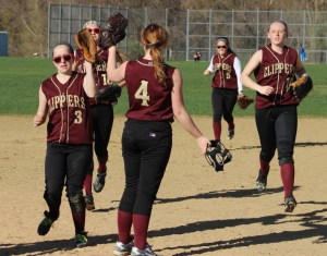 Pitcher Vicki Allman (#4) congratulates her teammates after the game