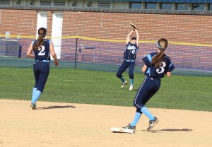 Casey Ross battles the sun to catch a fly ball in center.