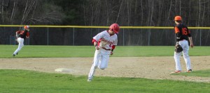 Mike Swanson heads for home with the seventh Sachems run