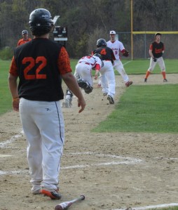 Luke Sirois (#4) caught in a rundown by catcher Johnny Prentice