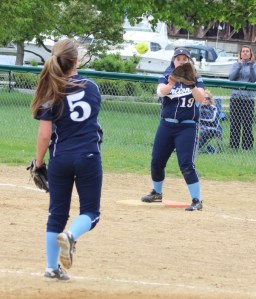 Triton pitcher Haley Johnson throws to 1B Lilly Anderson